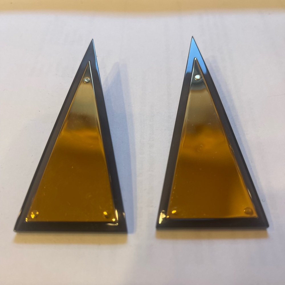 JW Anderson triangle gold and black earrings
